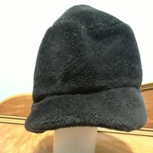 A hat that's either dark brown or black.